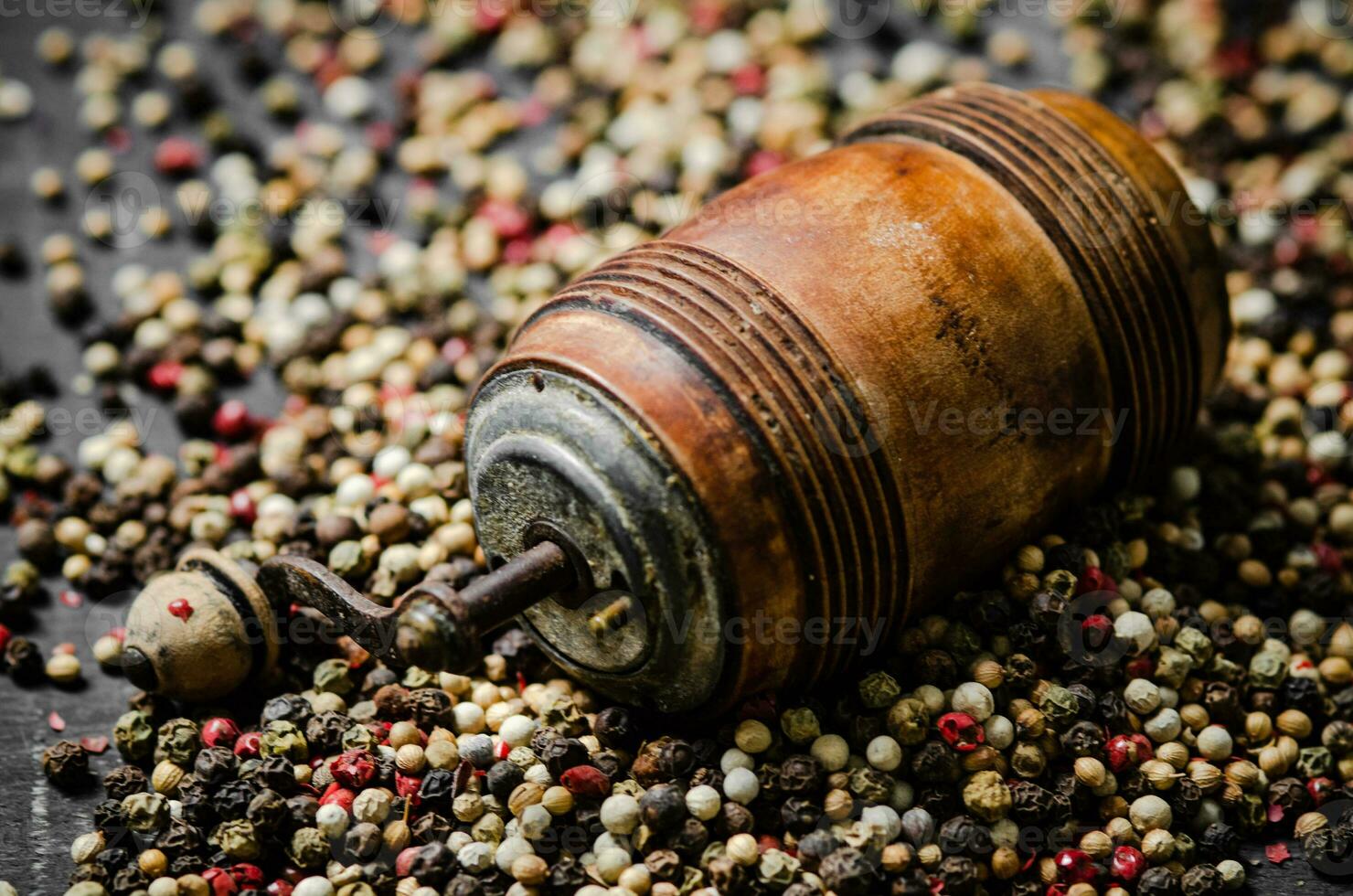 Peppercorn on rustic background. photo