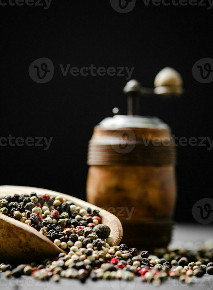 Peppercorn on rustic background. photo