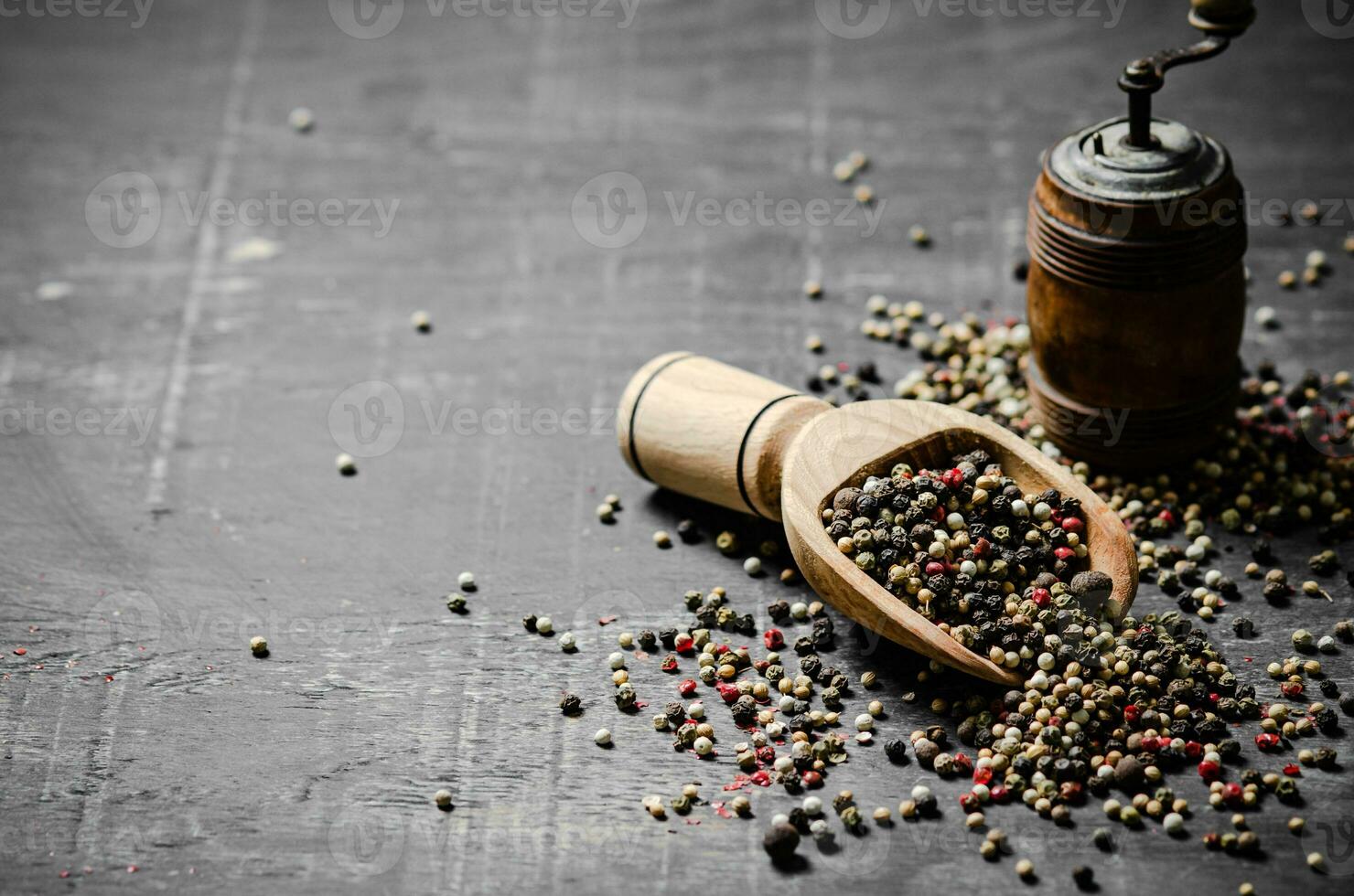 Peppercorn on rustic background. photo