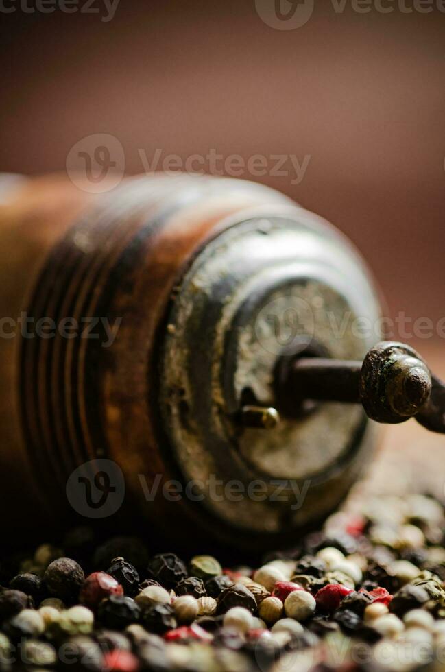 Peppercorn on rustic background. photo