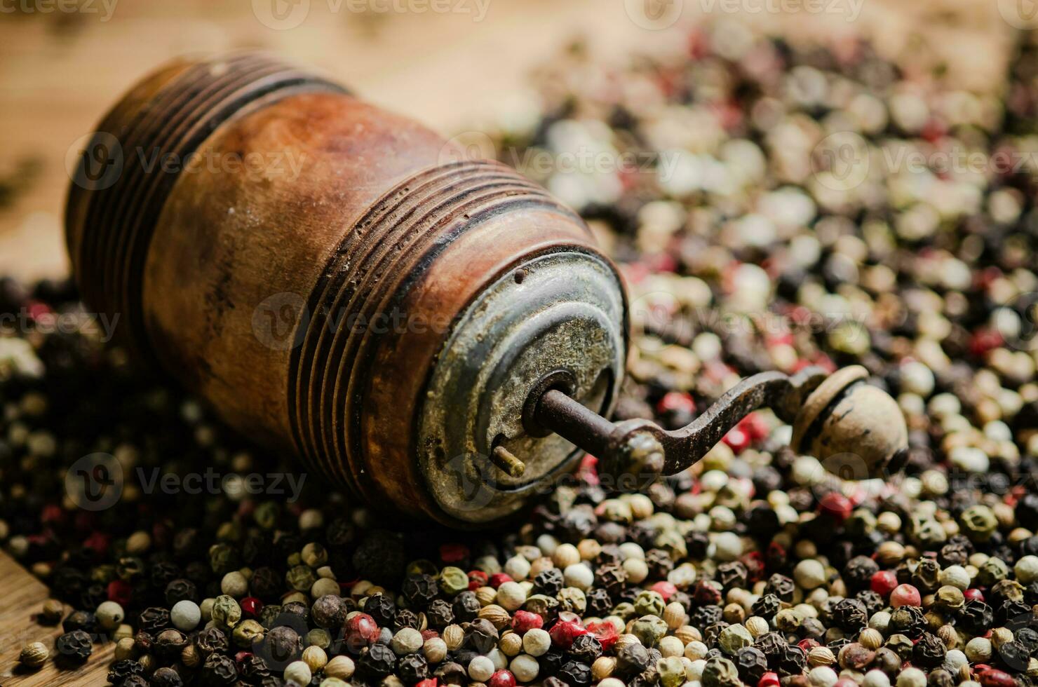Peppercorn on rustic background. photo