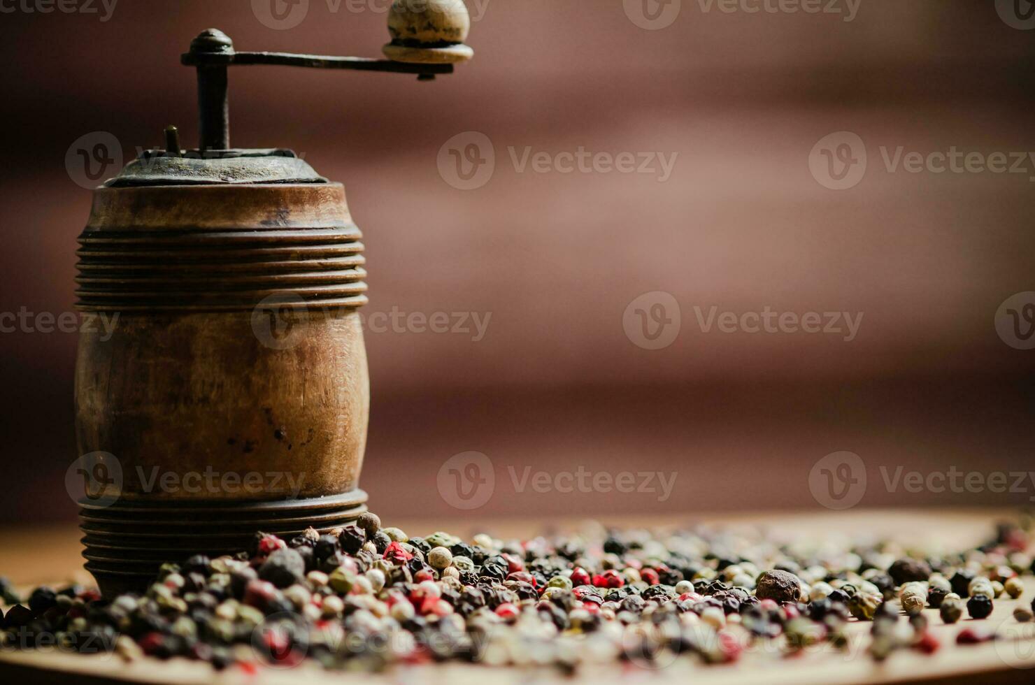 Peppercorn on rustic background. photo