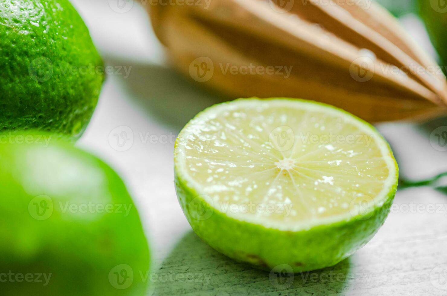 Fresh limes. On white table. photo