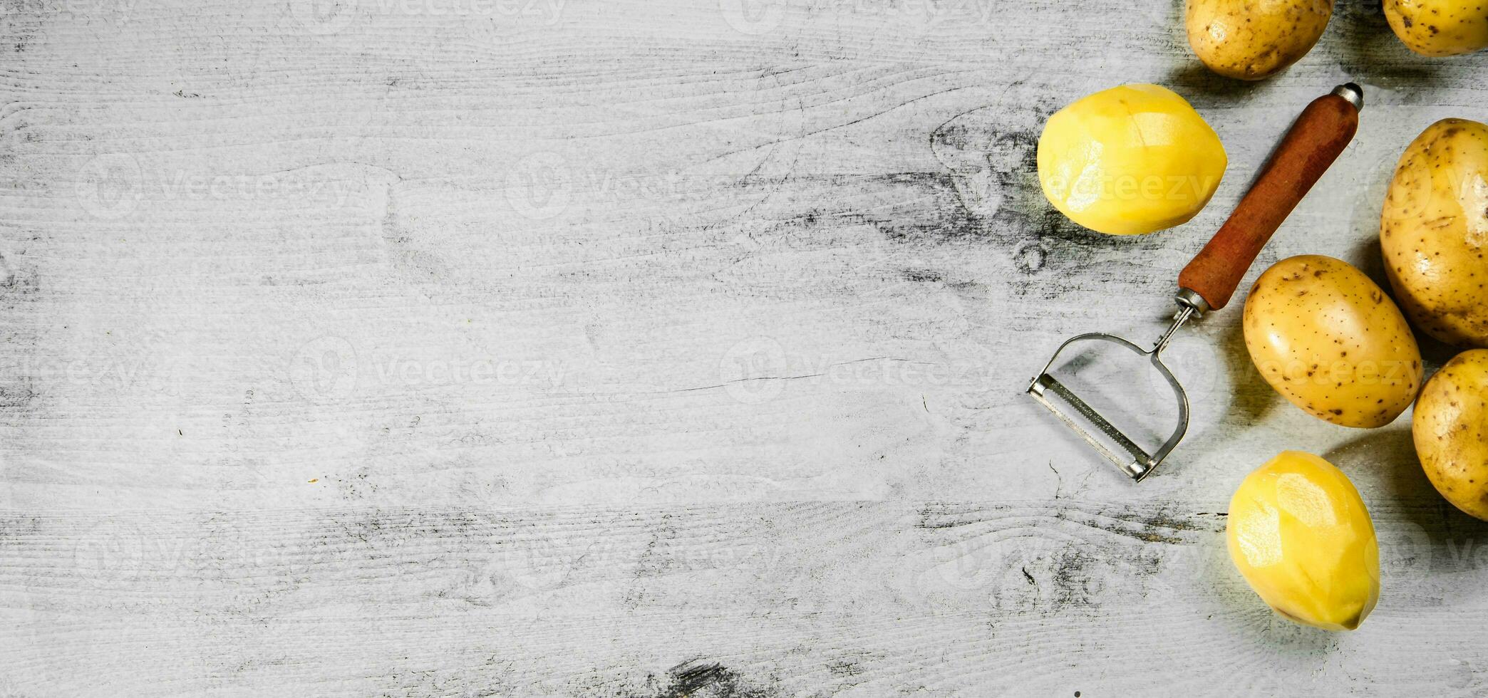 Fresh potatoes. On white table. photo