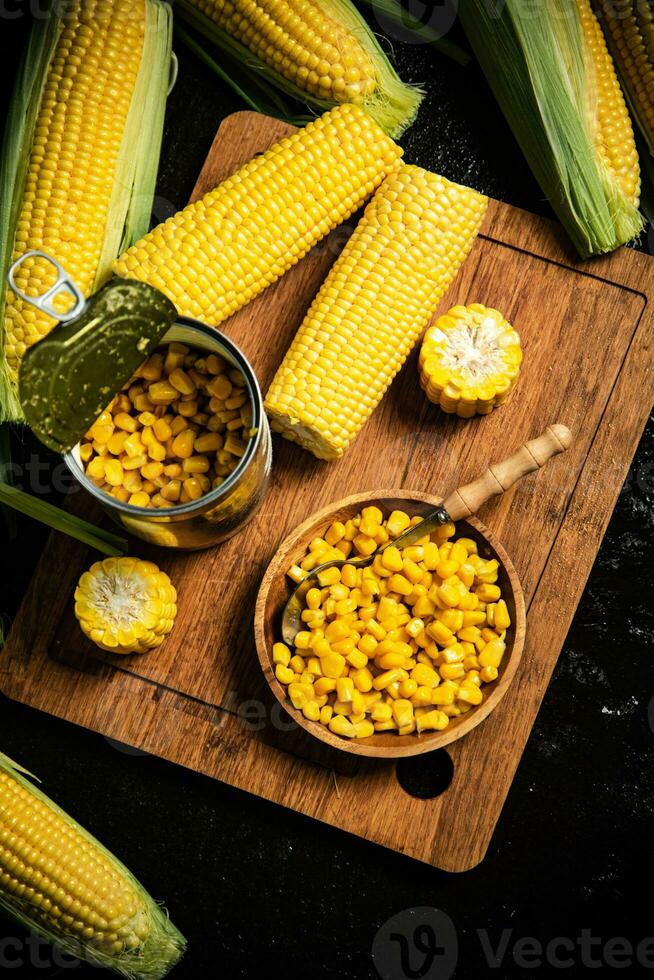 Canned corn on board. photo