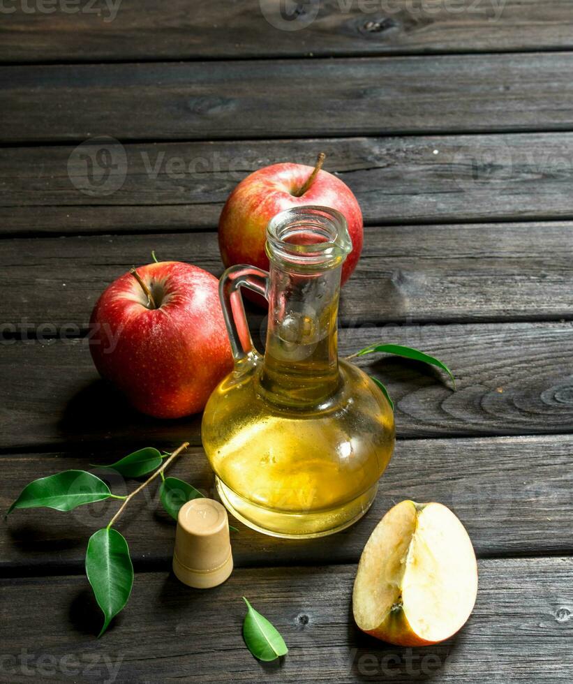 Apple cider vinegar with fresh apples. photo