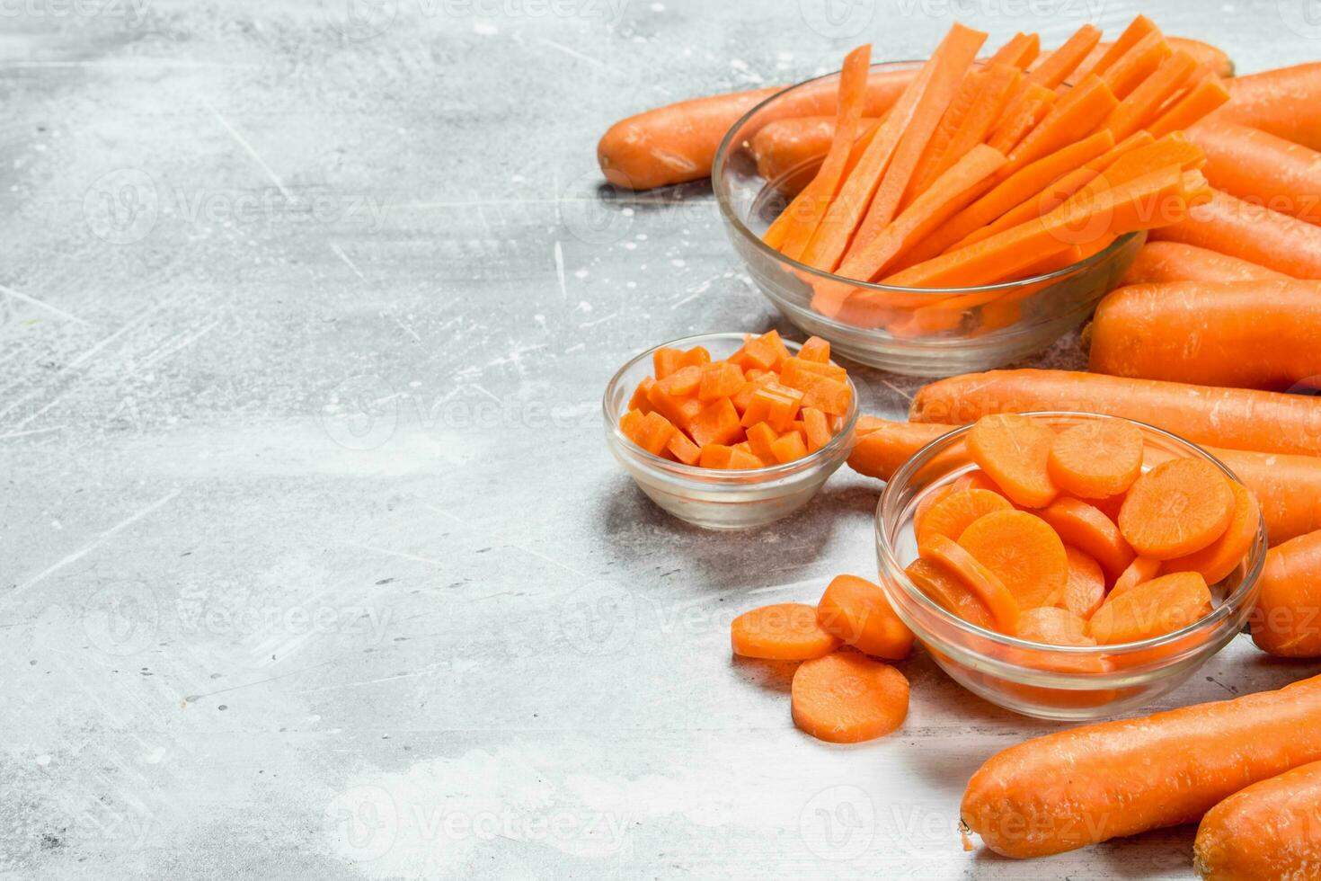 Slices of carrots in a glass bowl. photo