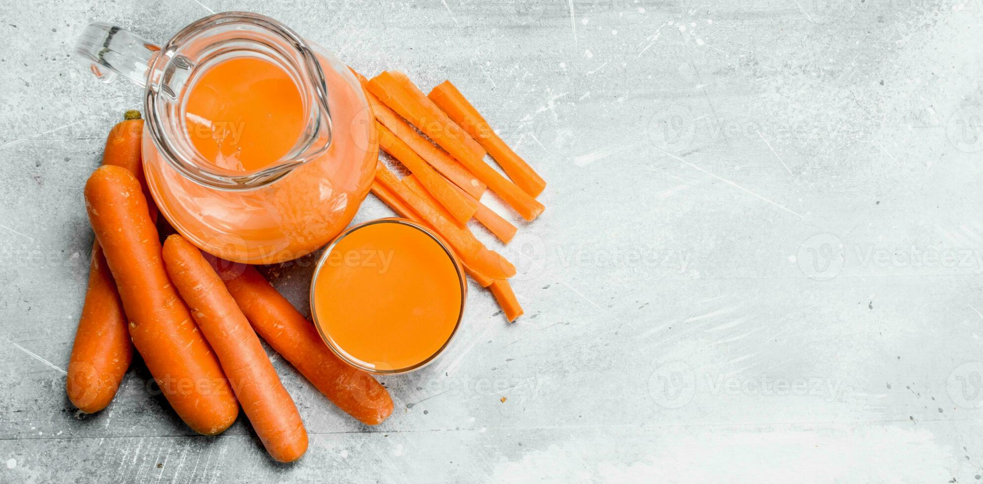 Carrot juice in the pitcher. photo