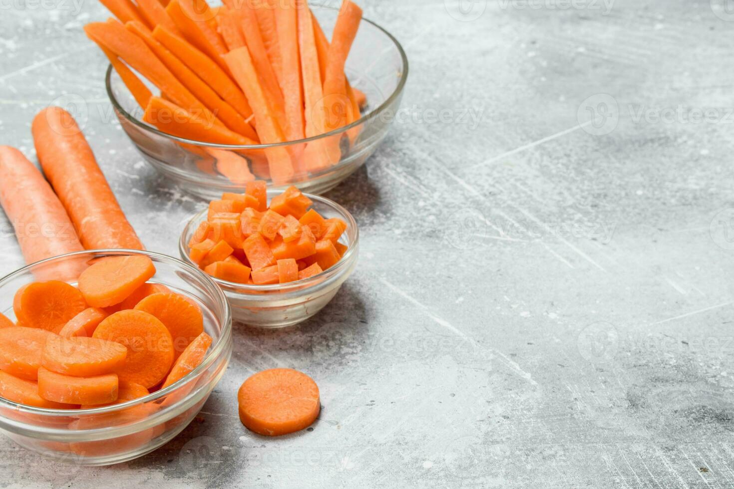 Slices of carrots in a glass bowl. photo