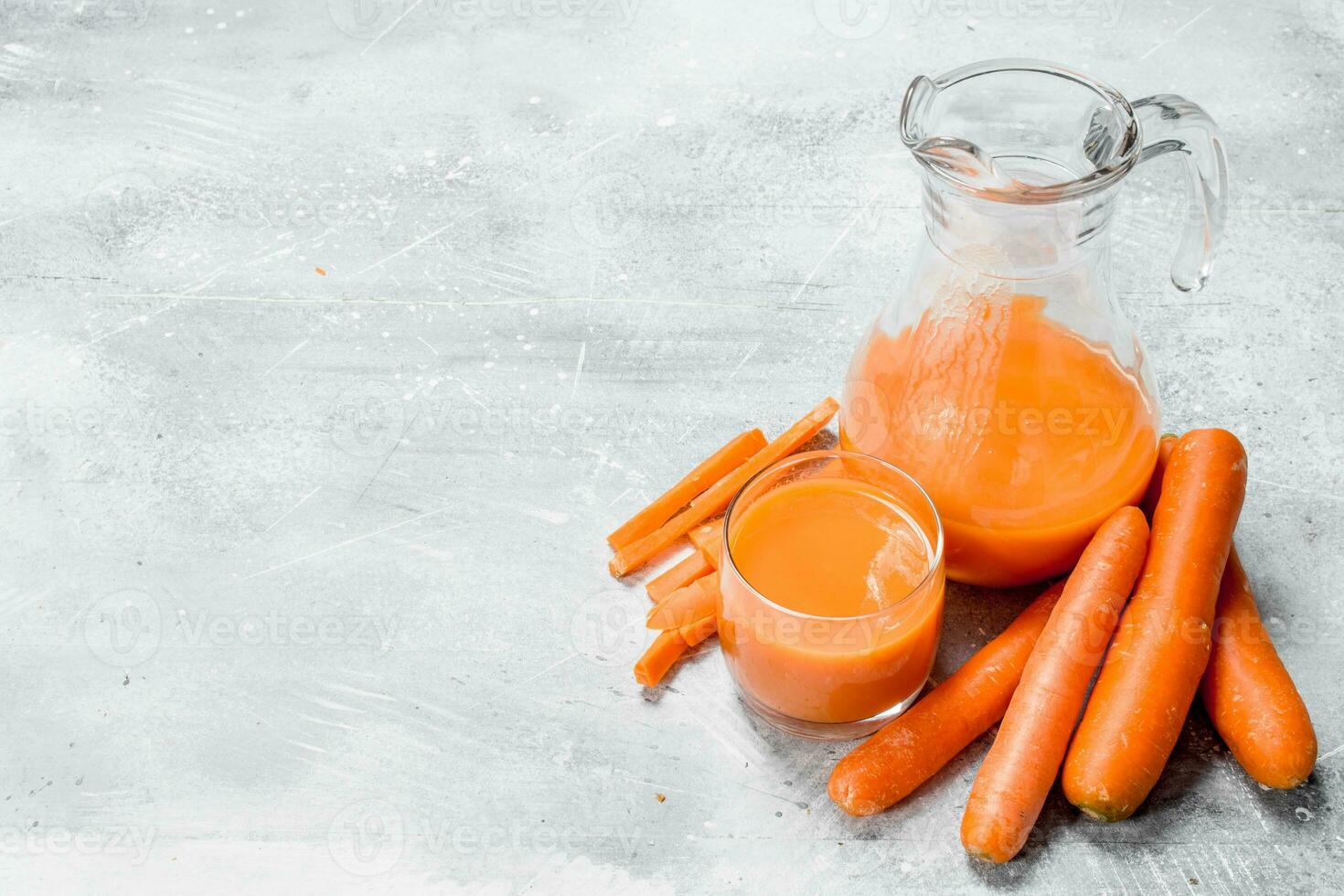 Carrot juice in the pitcher. photo