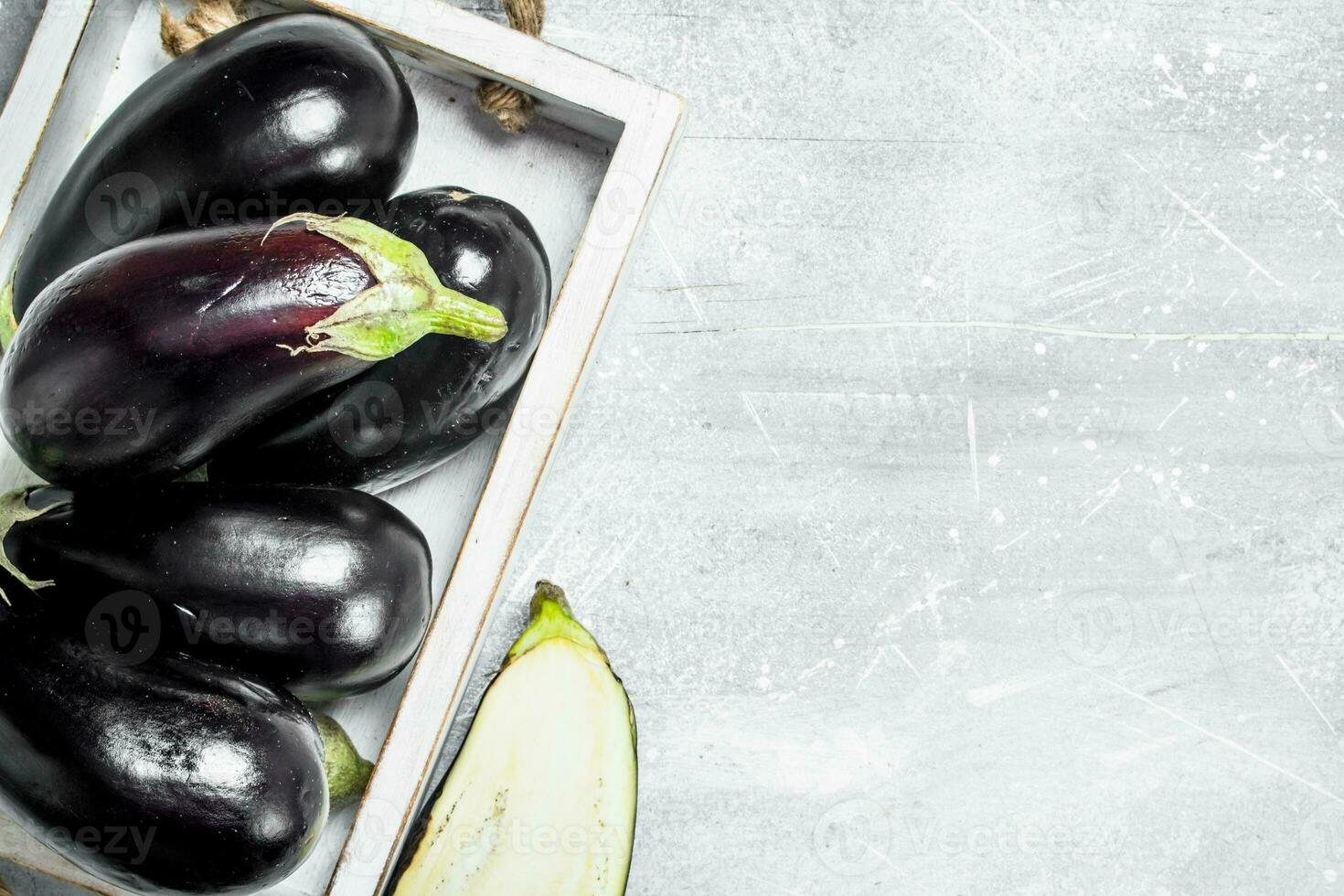 Fresh eggplant on tray. photo