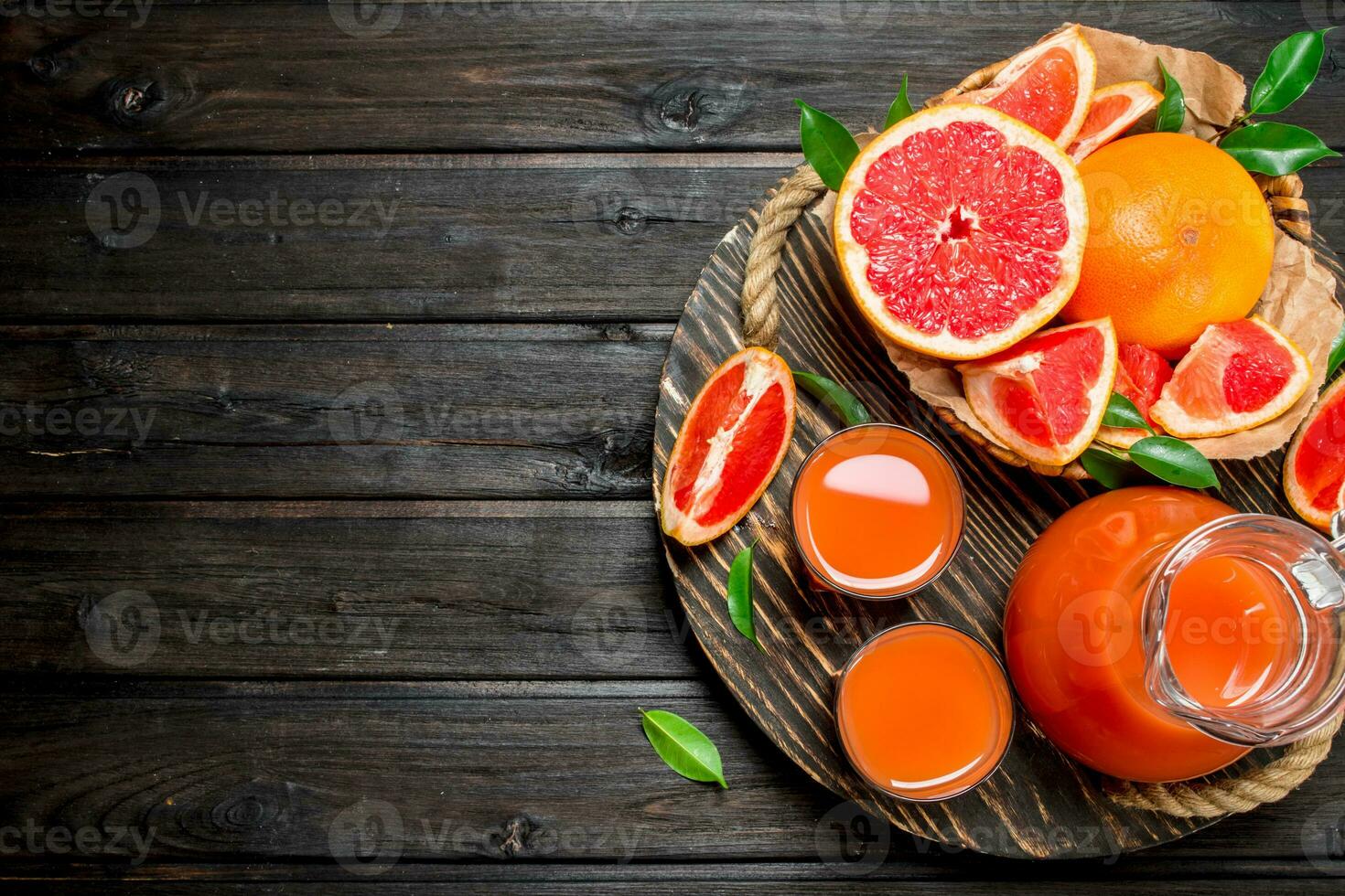 Grapefruit juice in a glass on tray. photo