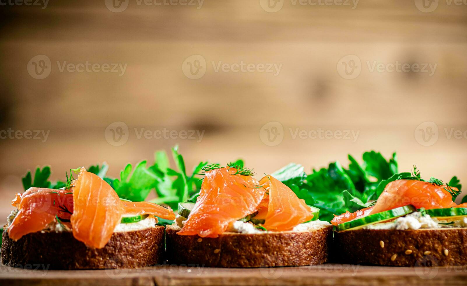 Delicious sandwich with salmon and parsley. photo
