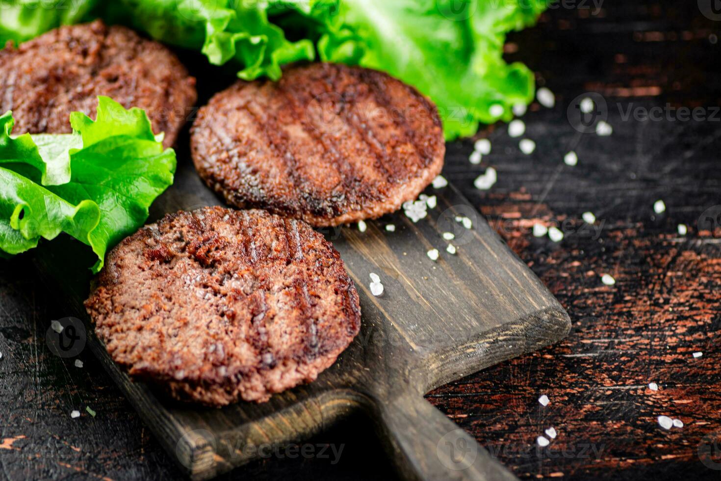Fragrant grilled burger with greens. photo