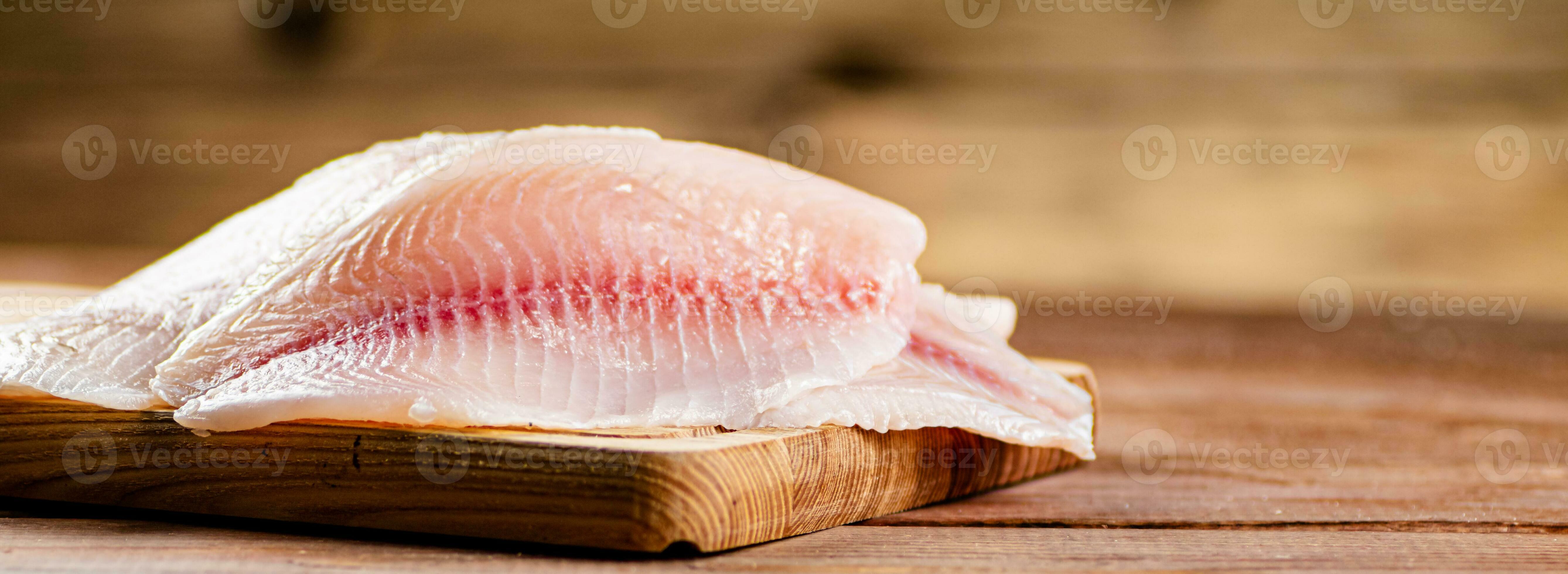 Fresh fish fillet on a cutting board. 31989872 Stock Photo at Vecteezy