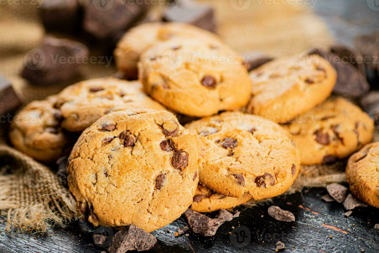 A pile of milk chocolate cookies. photo
