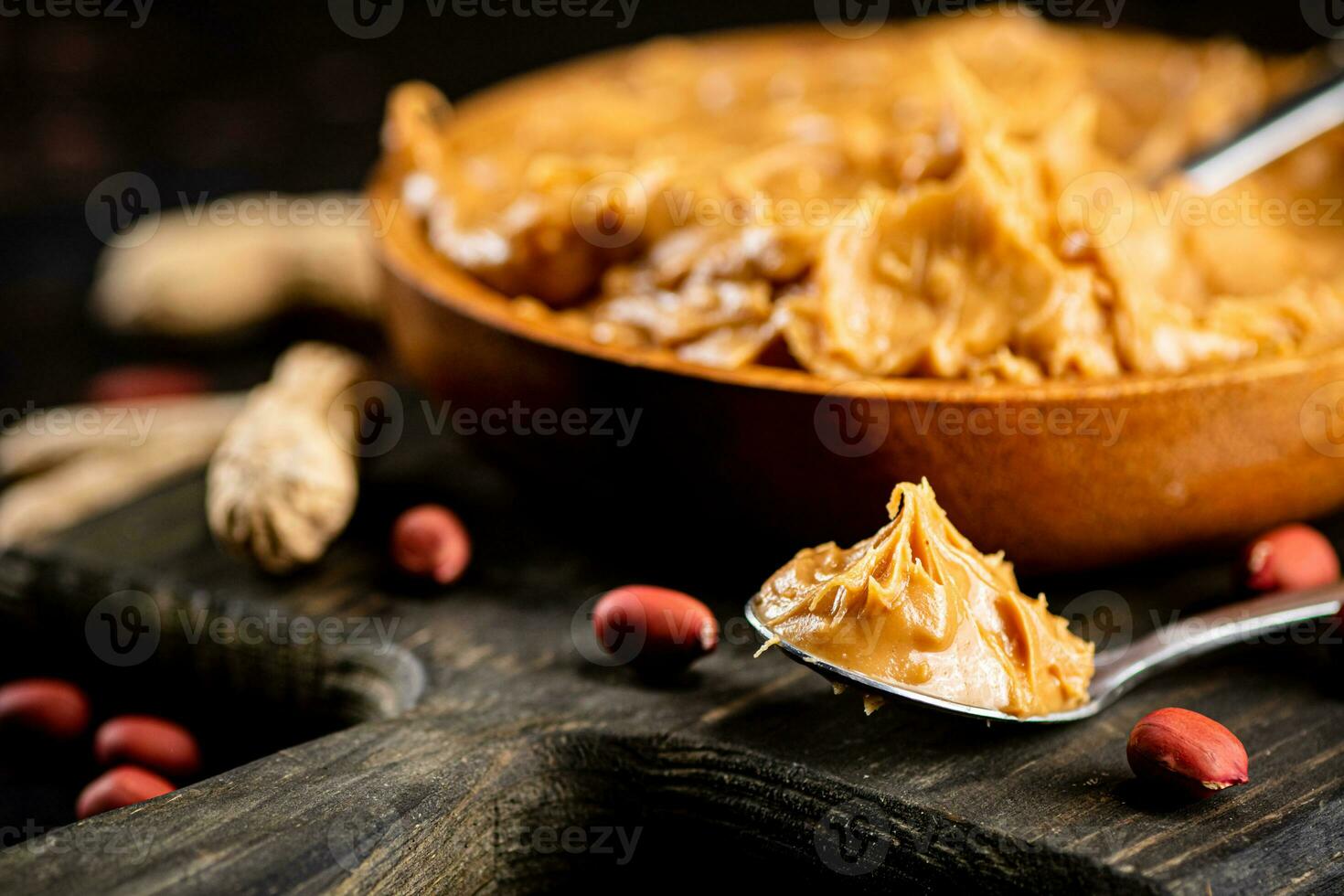 Peanut butter on a plate with a spoon. photo