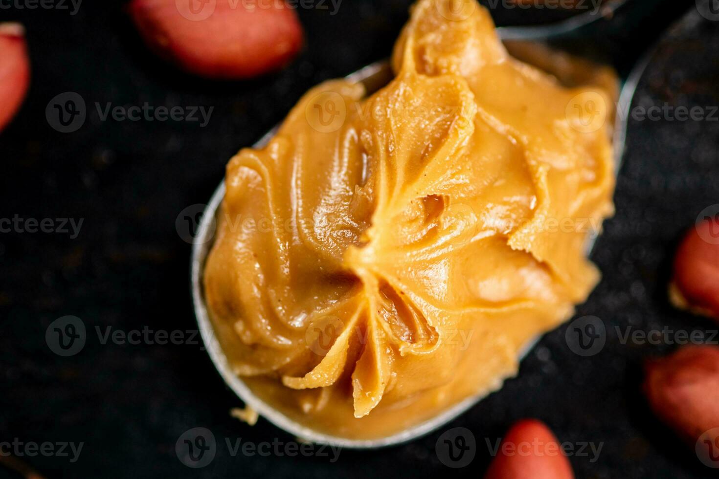A spoonful full of peanut butter. photo