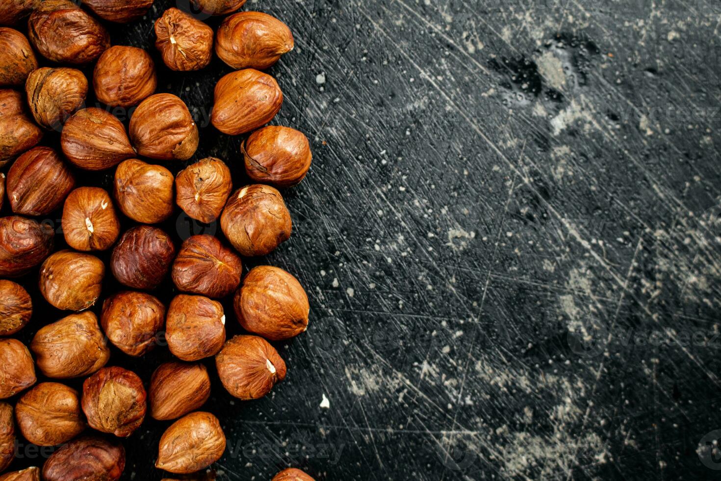 Peeled hazelnuts on the table. photo