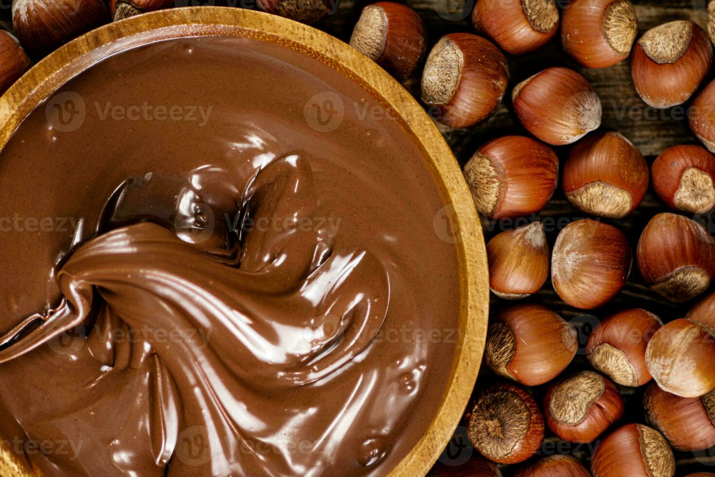 Hazelnut butter on a wooden plate. photo