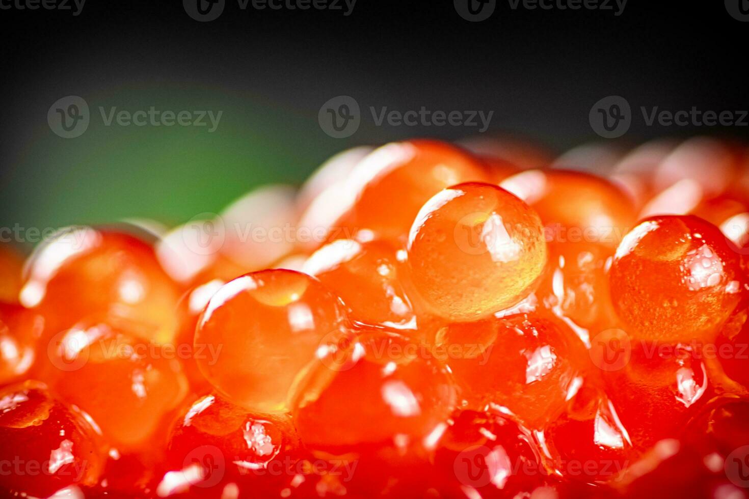 Grains of red caviar. Red caviar texture. photo