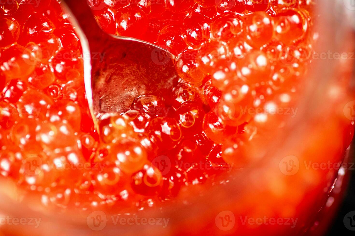 Red caviar with a spoon. photo