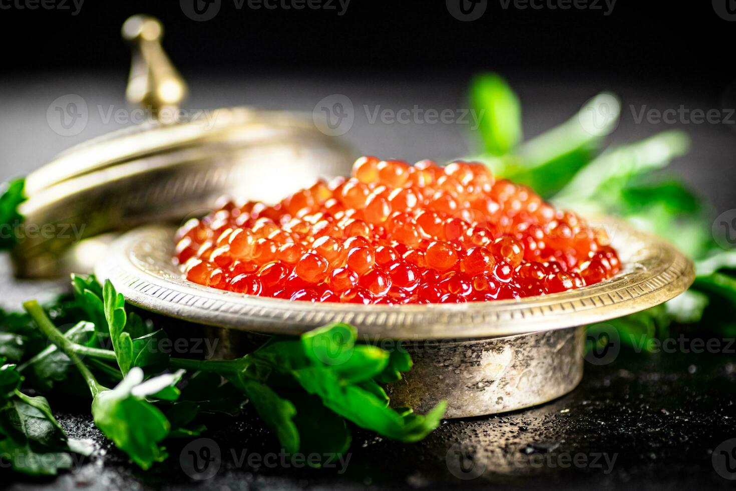 Full bowl of red caviar on the table. photo