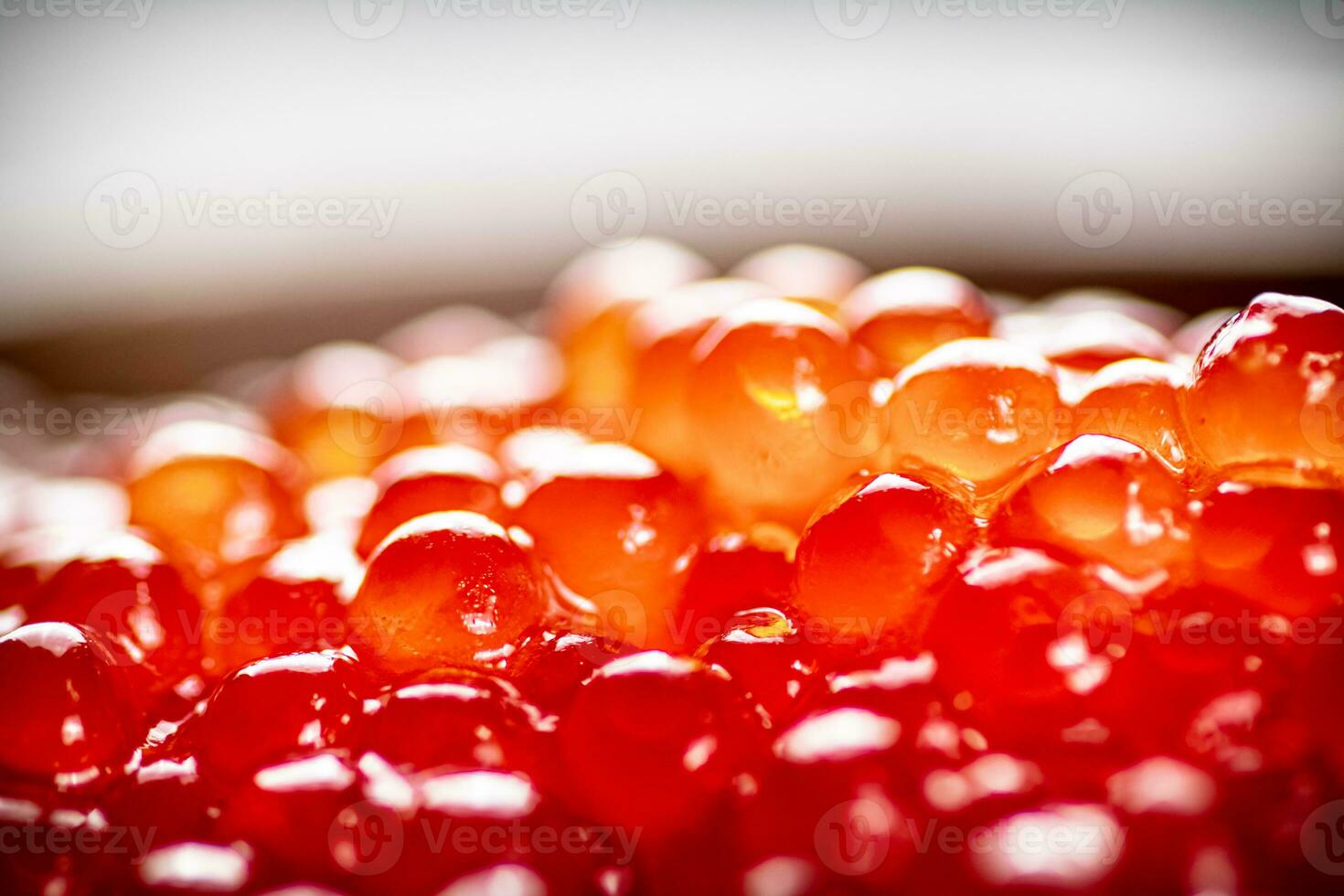 Grains of delicious red caviar. Macro background. photo