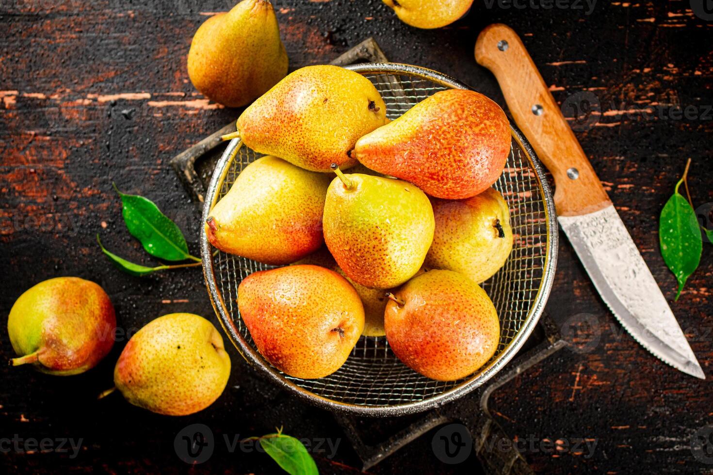 Ripe pears in a colander. photo