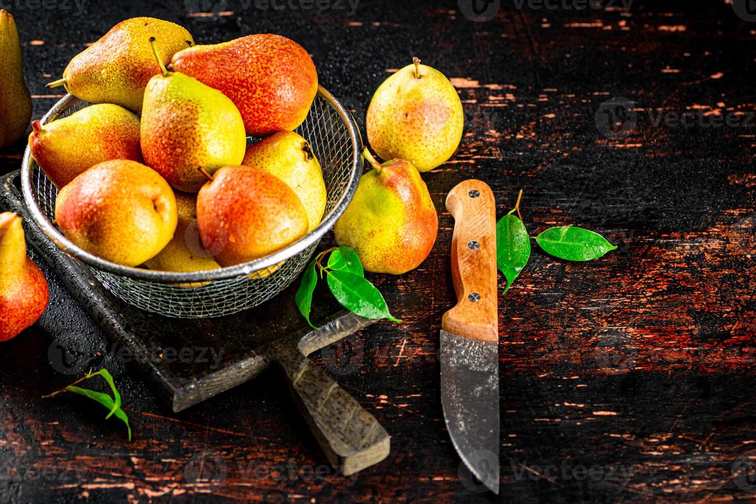 Ripe pears in a colander. photo