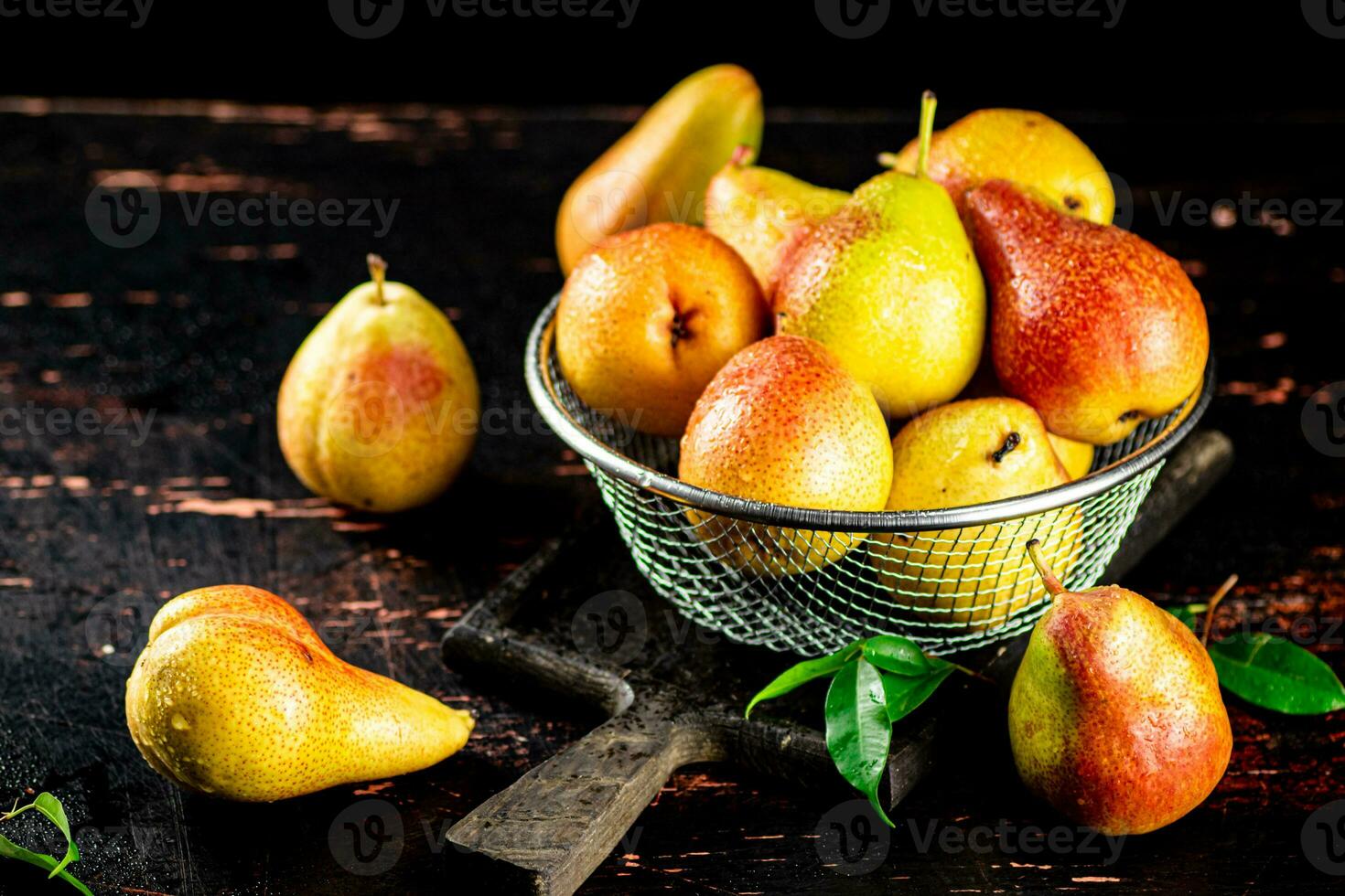 Ripe pears in a colander. photo