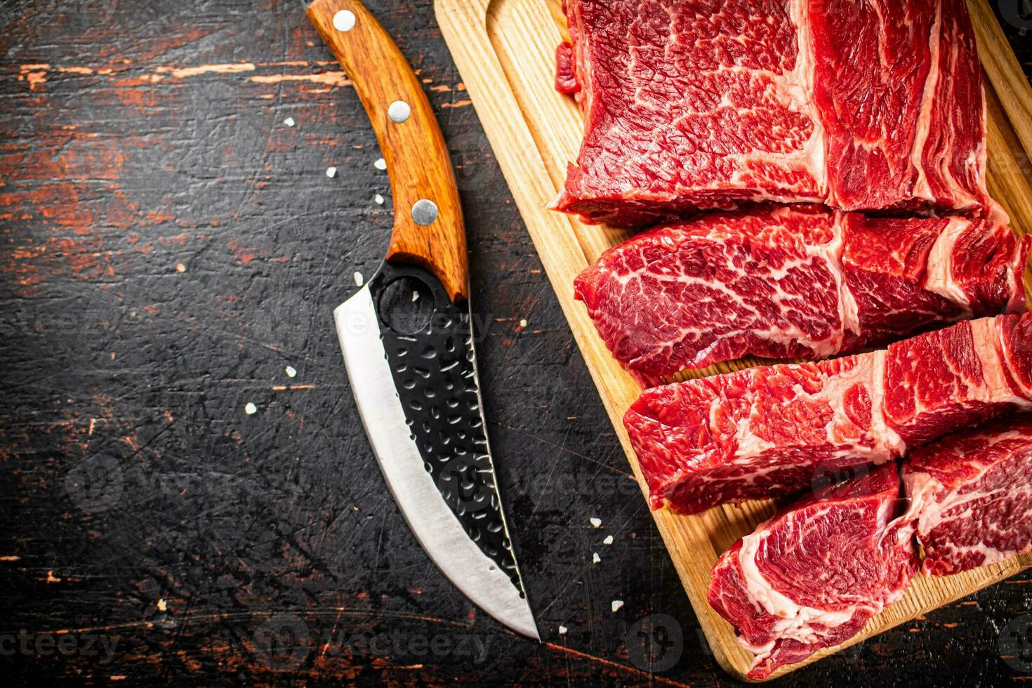 Beef raw cut on a cutting board. photo
