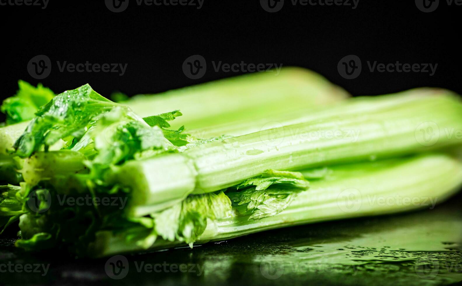 Stalks of fresh celery on the table. photo