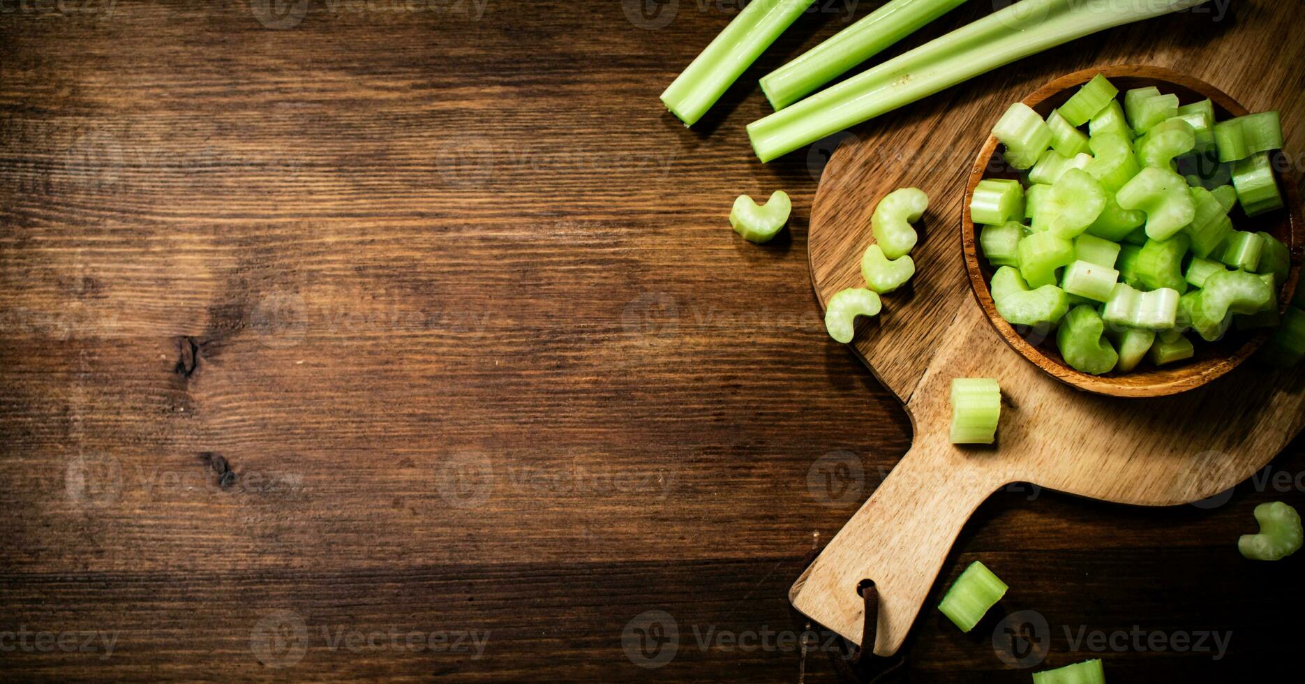 Sliced fresh celery on a cutting board. photo