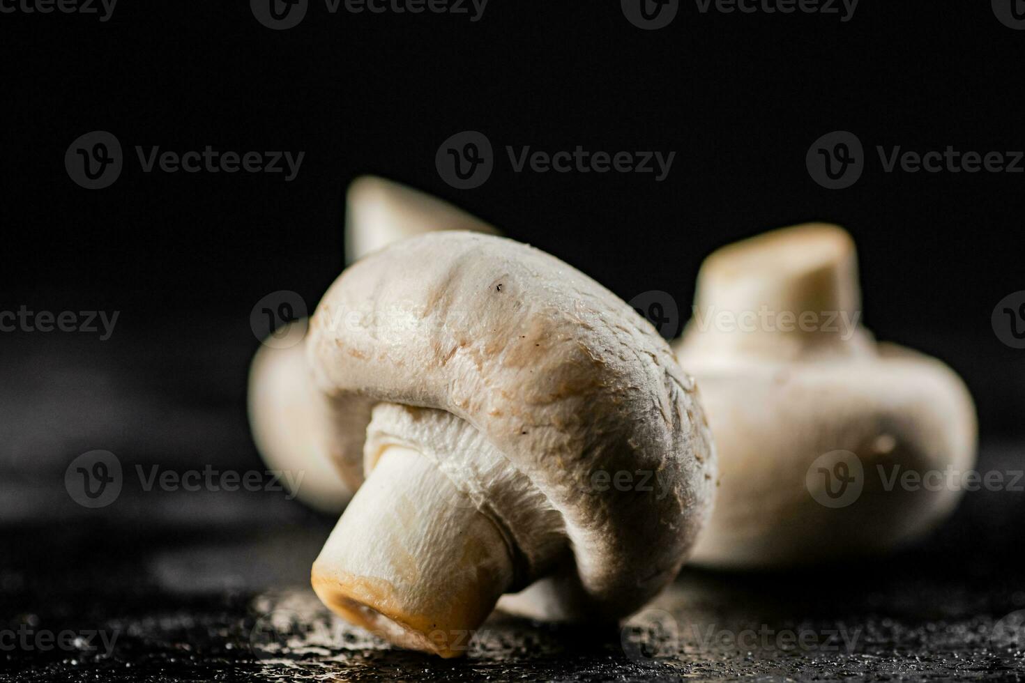 Fresh mushrooms champignons on the table. photo