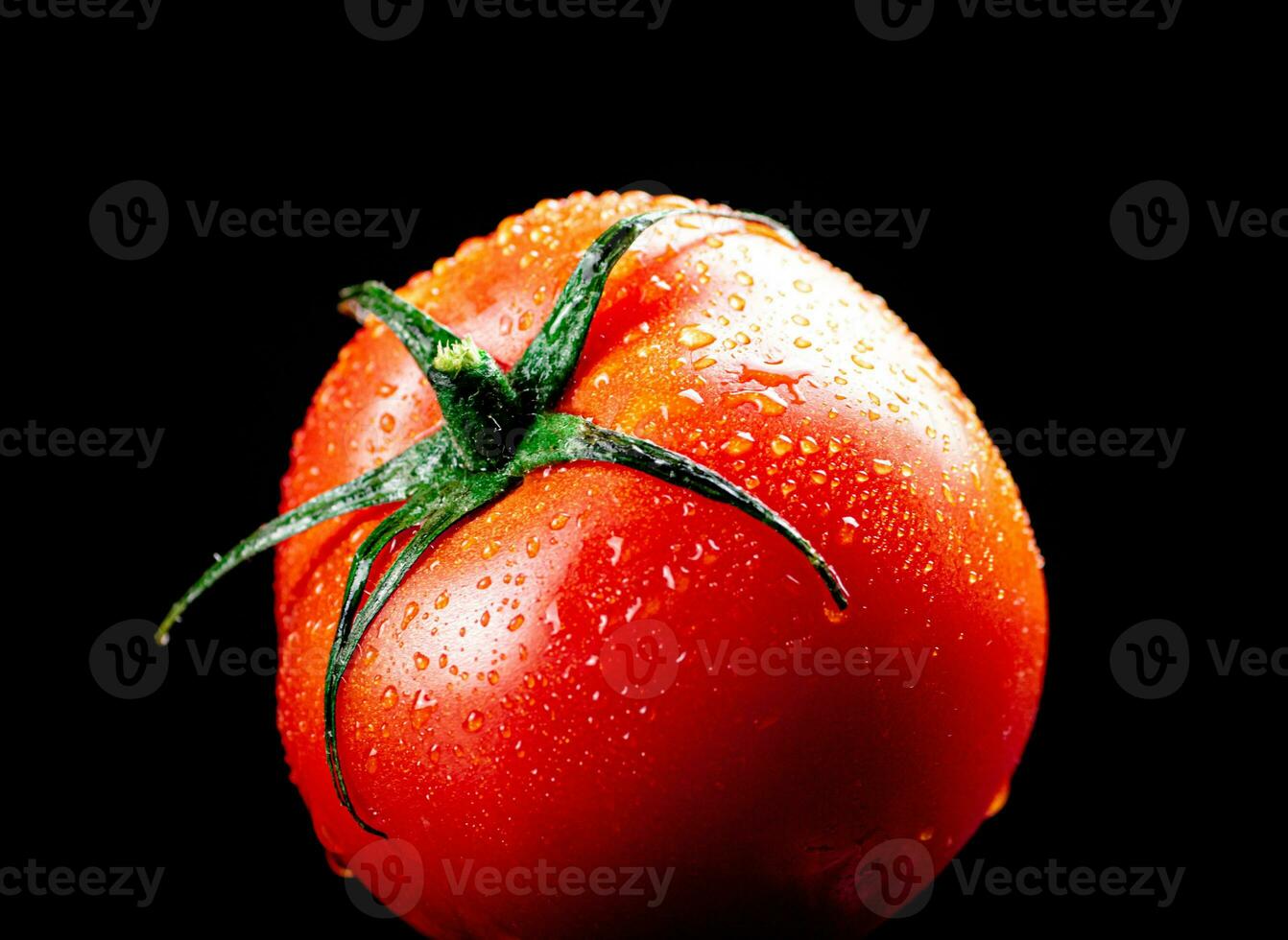 One ripe tomato on the table. photo
