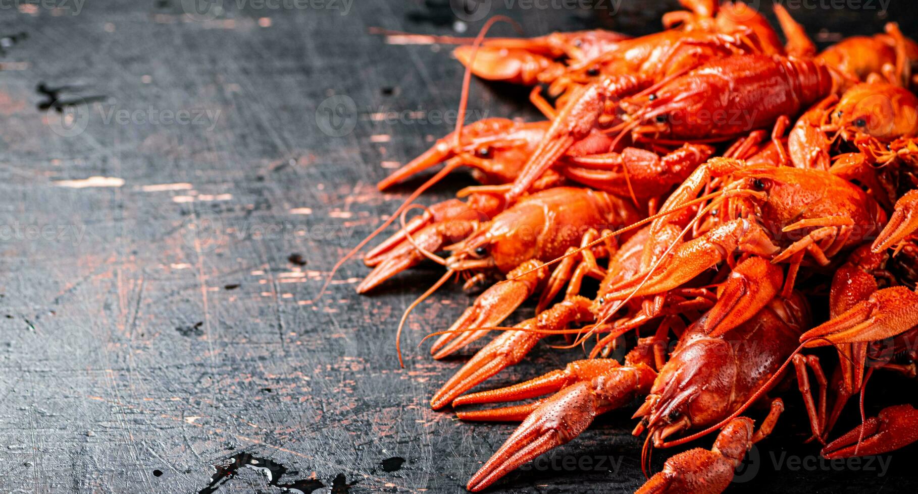 A bunch of boiled crayfish on the table. photo