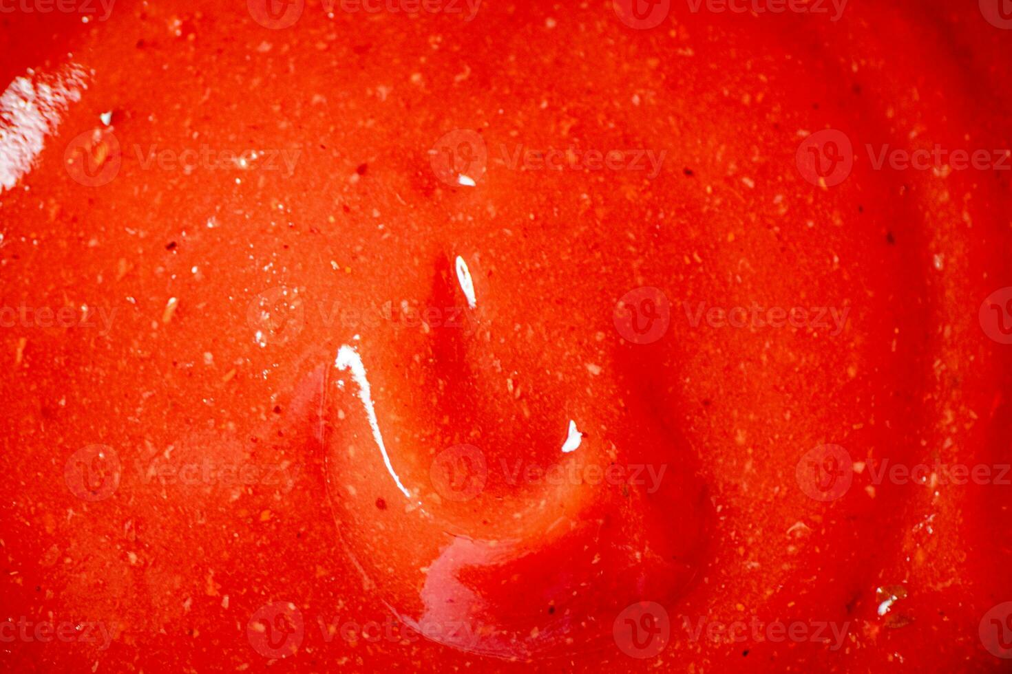 Catsup. Macro background. The texture of tomato sauce. photo