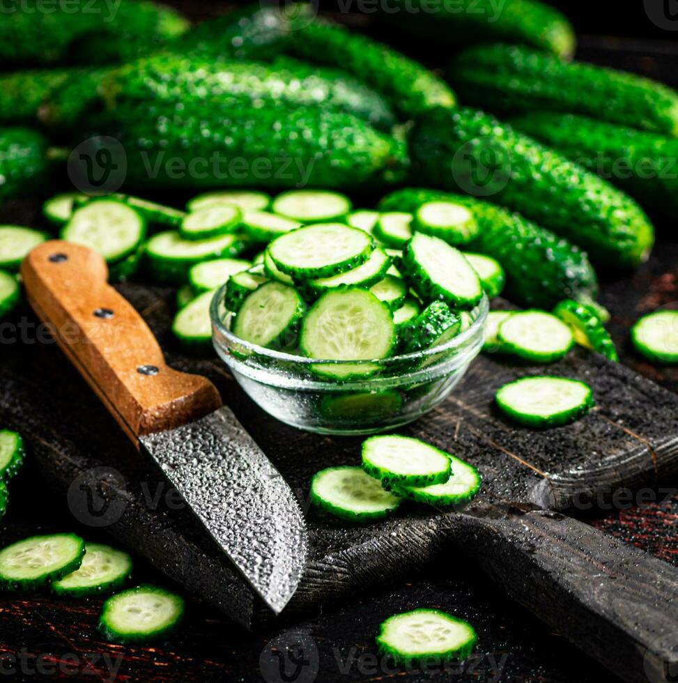 Cucumbers cut on a cutting board. photo
