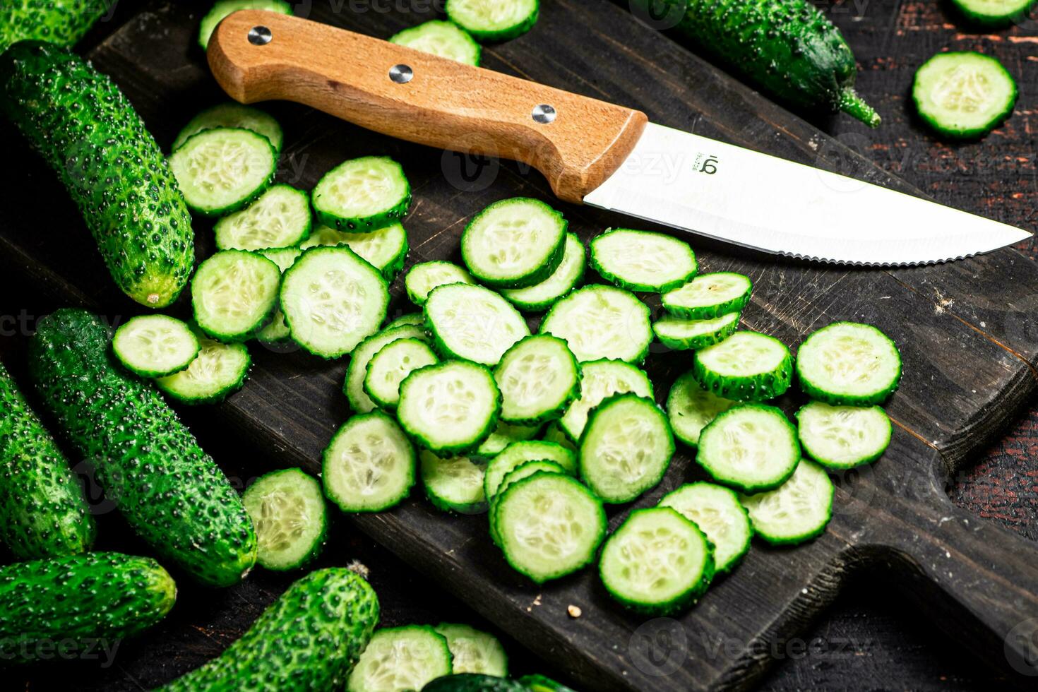 Cucumbers cut on a cutting board. photo