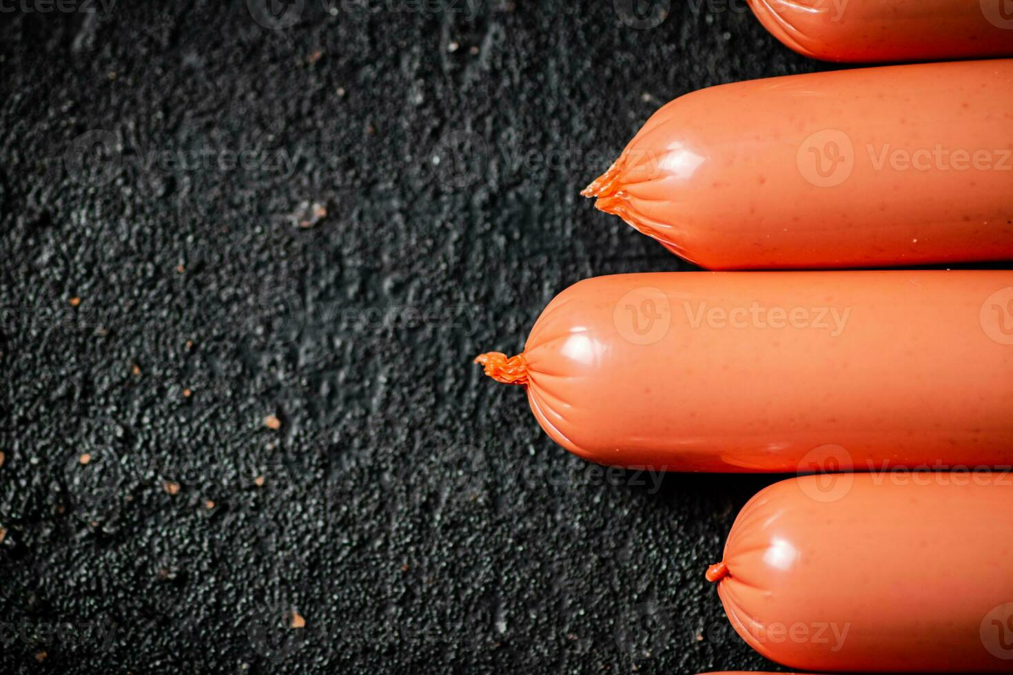 The sausages boiled on the table are in a row. photo