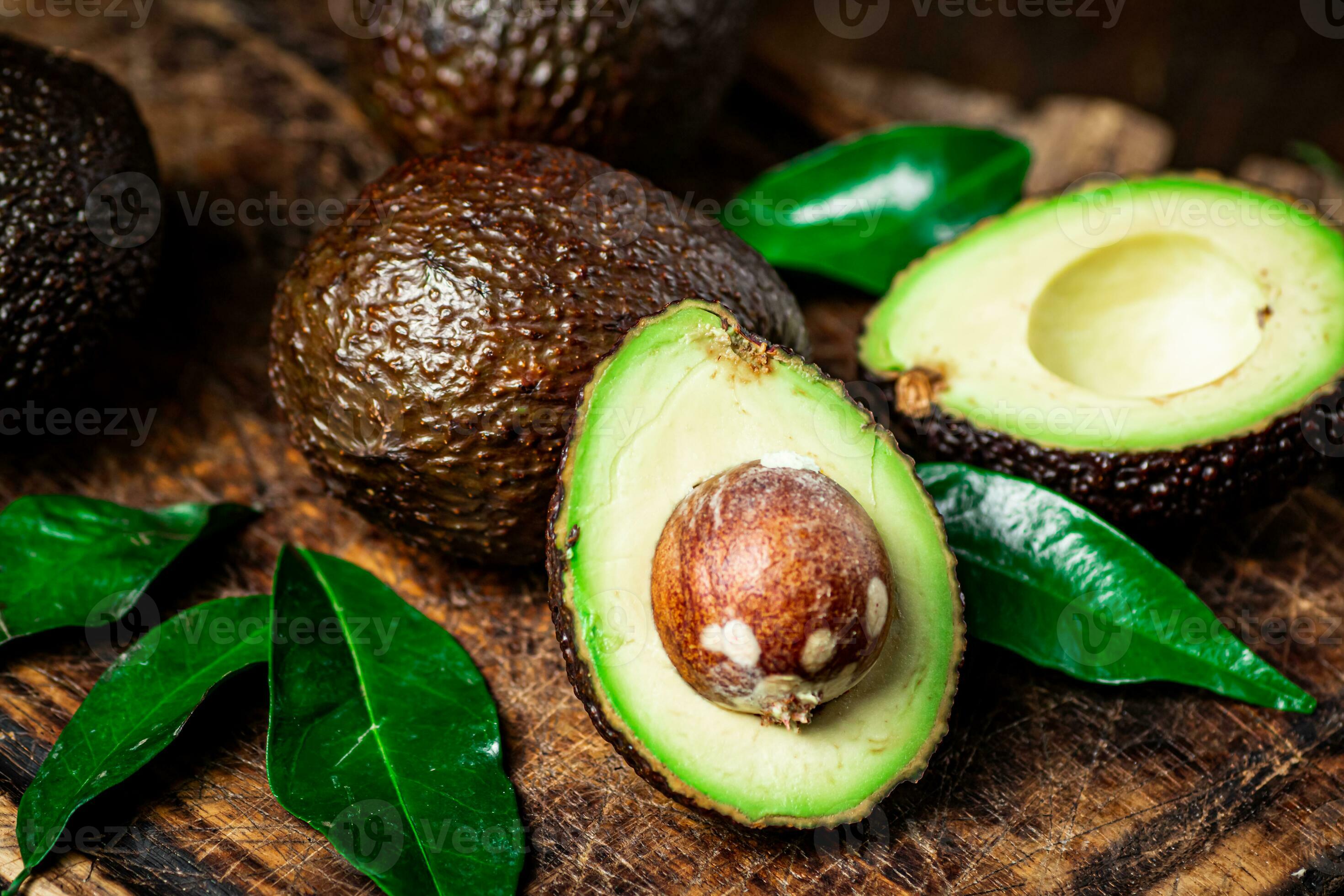 Halves of fresh avocado on a cutting board. 31996423 Stock Photo at Vecteezy