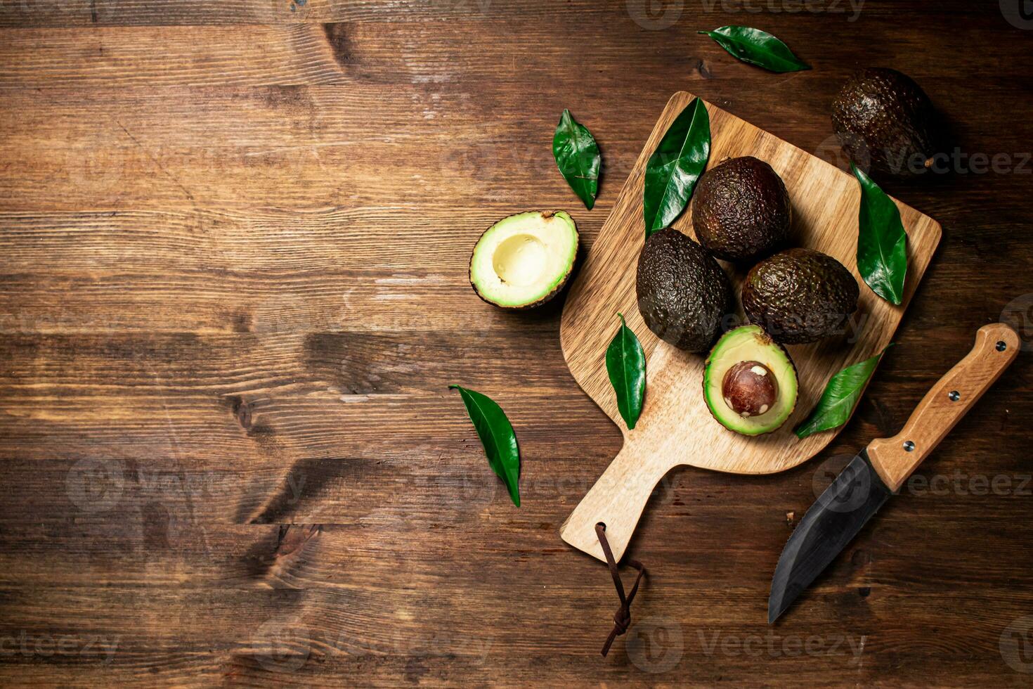 Halves of fresh avocado on a cutting board. 31996423 Stock Photo at Vecteezy