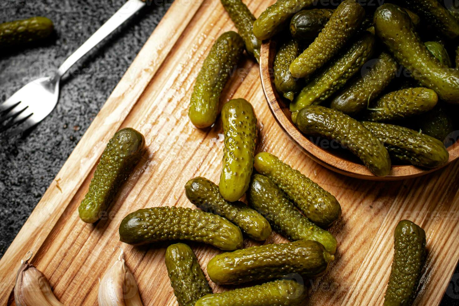 Pickles cucumber on a cutting board. photo