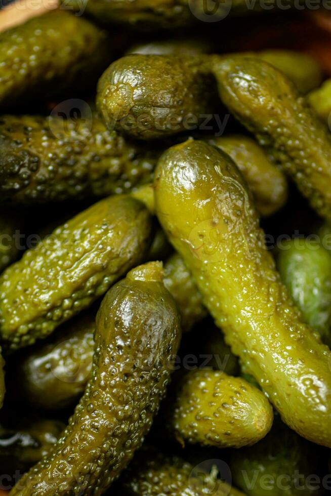 Pickled cucumber. Macro background. The texture of pickles. photo