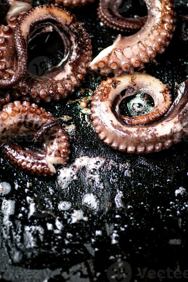 An octopus in a frying pan. photo
