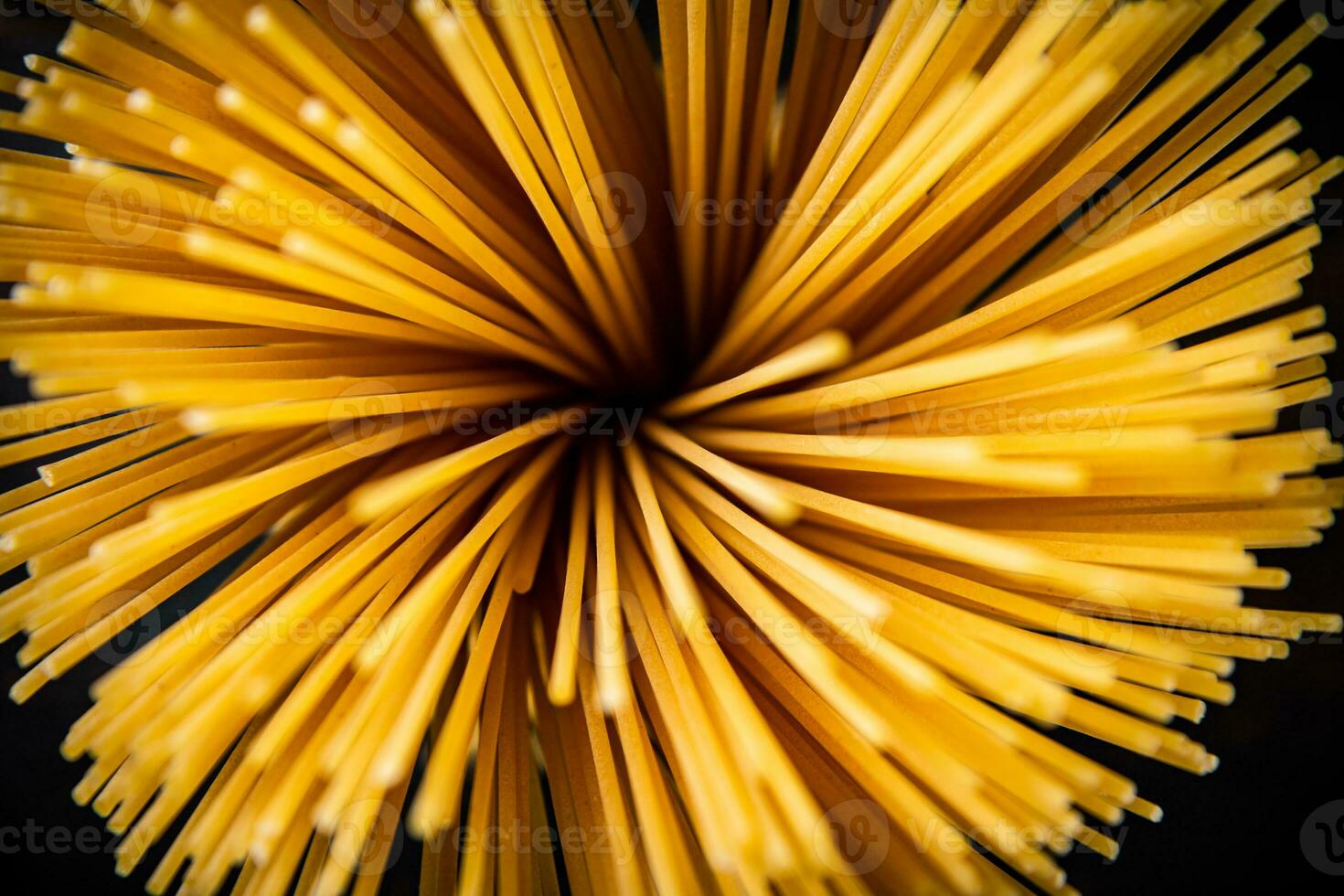 A bunch of dry pasta on the table. photo