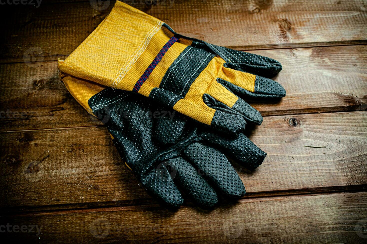 A pair of construction gloves on the table. photo