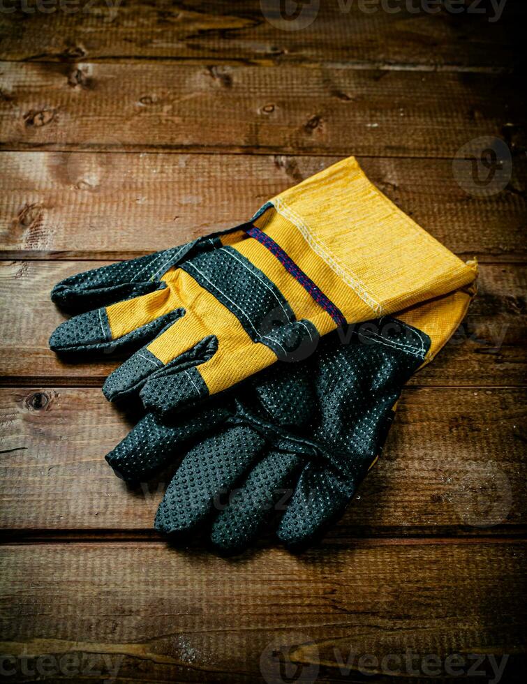 A pair of construction gloves on the table. photo