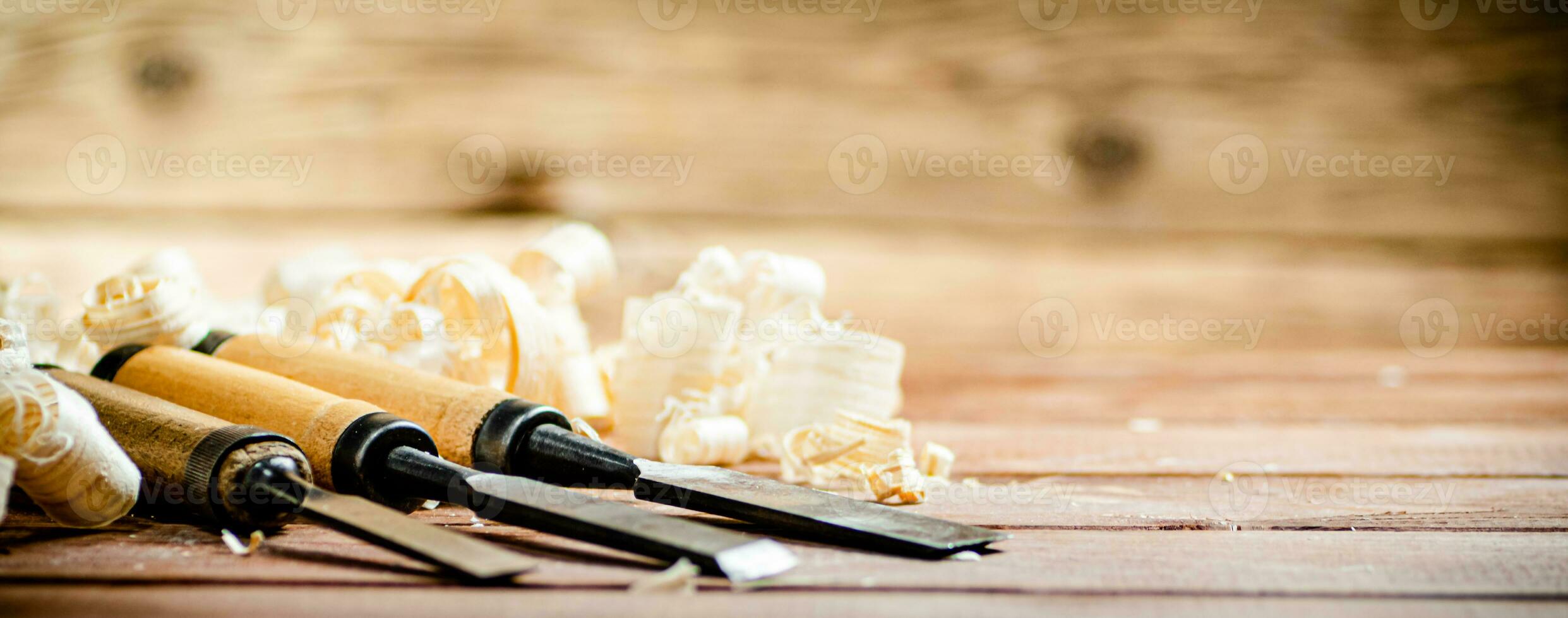 Chisel with a bunch of wood sawdust. photo